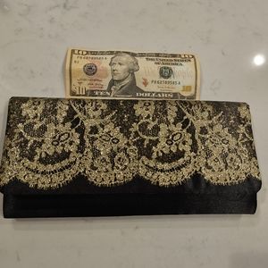 Lace clutch. Never been used.